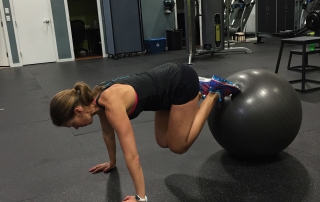 Core training exercise with swiss ball